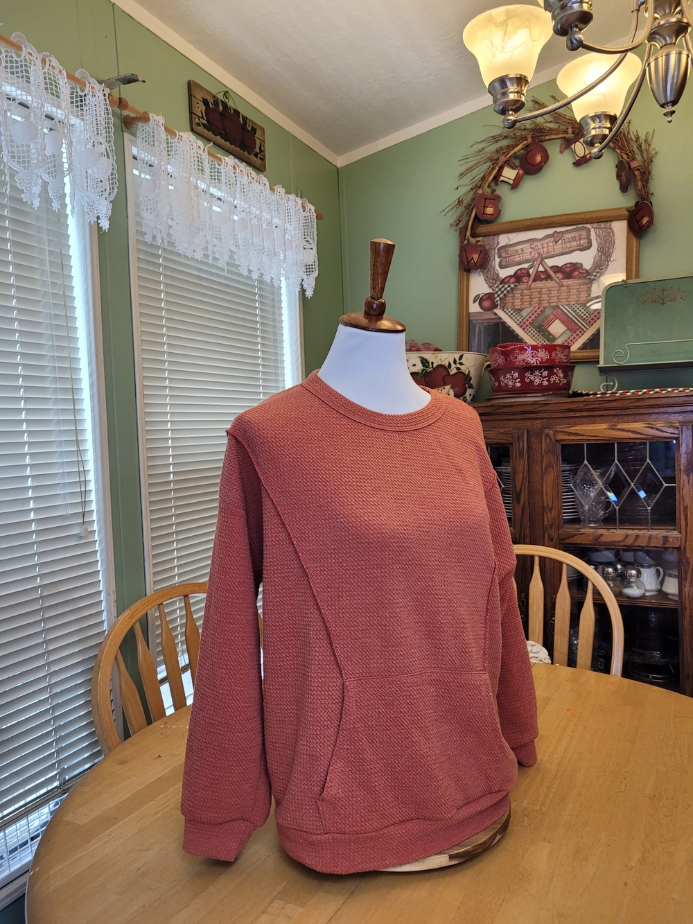 BiBi Women's Crewneck Sweater in Warm Rust Hue.